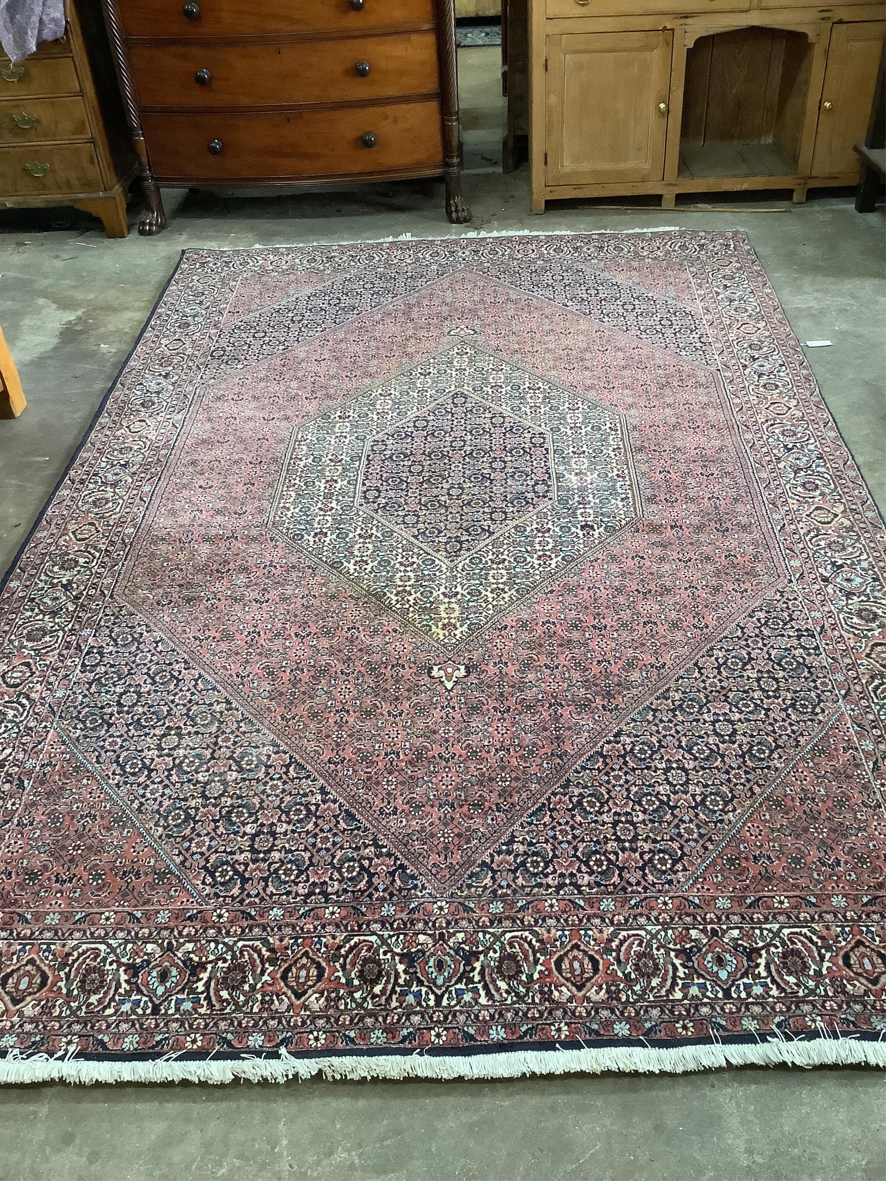 A North West Persian blue ground carpet, 300 x 200cm